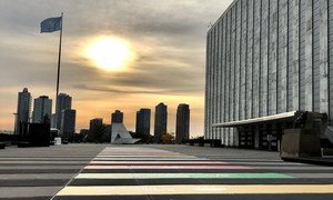 The sun rises over the SDGs path at the entrance to the UN General Assembly building in New York.